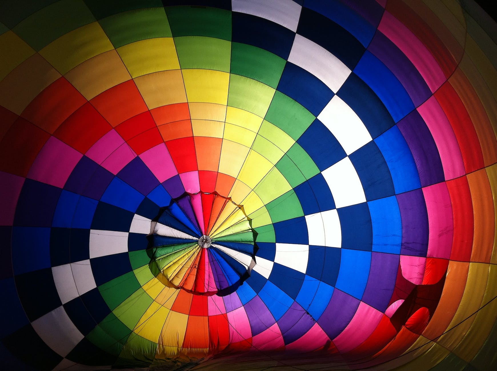The top of a colorful hot air balloon