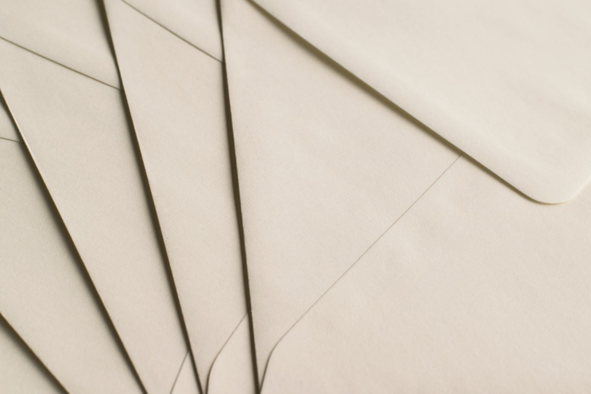 A small stack of envelopes that are spread out